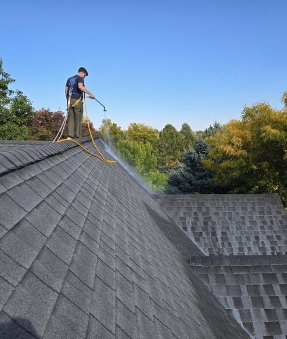 roofer in syracuse spraying roof maxx